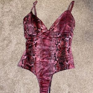 Pink snakeskin bodysuit